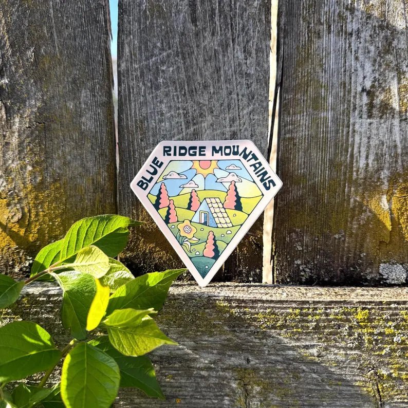 Sticker with 'Blue Ridge Mountains' design on a wooden background