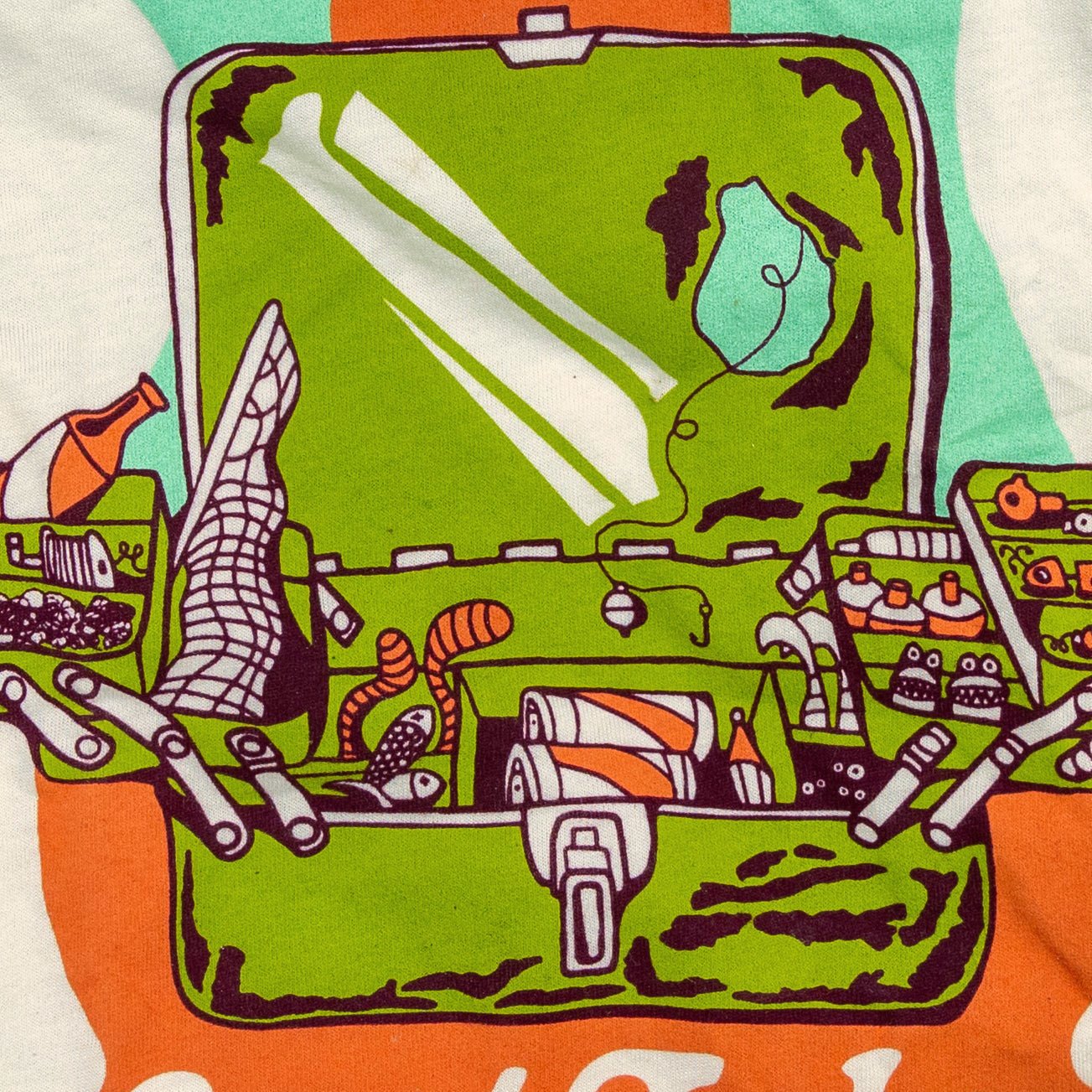 Close-up of vintage fishing tacklebox design on soft cotton-poly shirt