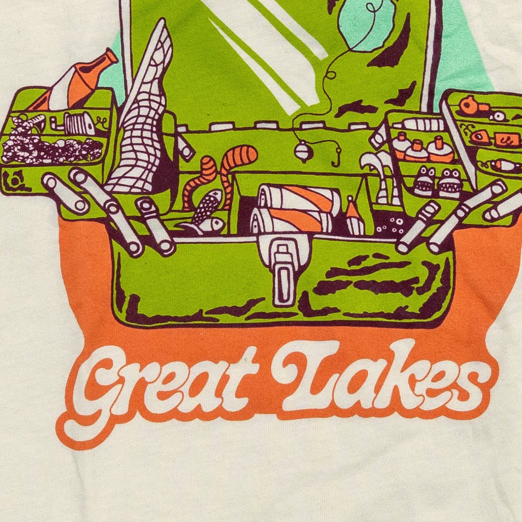 Close-up of vintage fishing tacklebox design on soft cotton-poly shirt