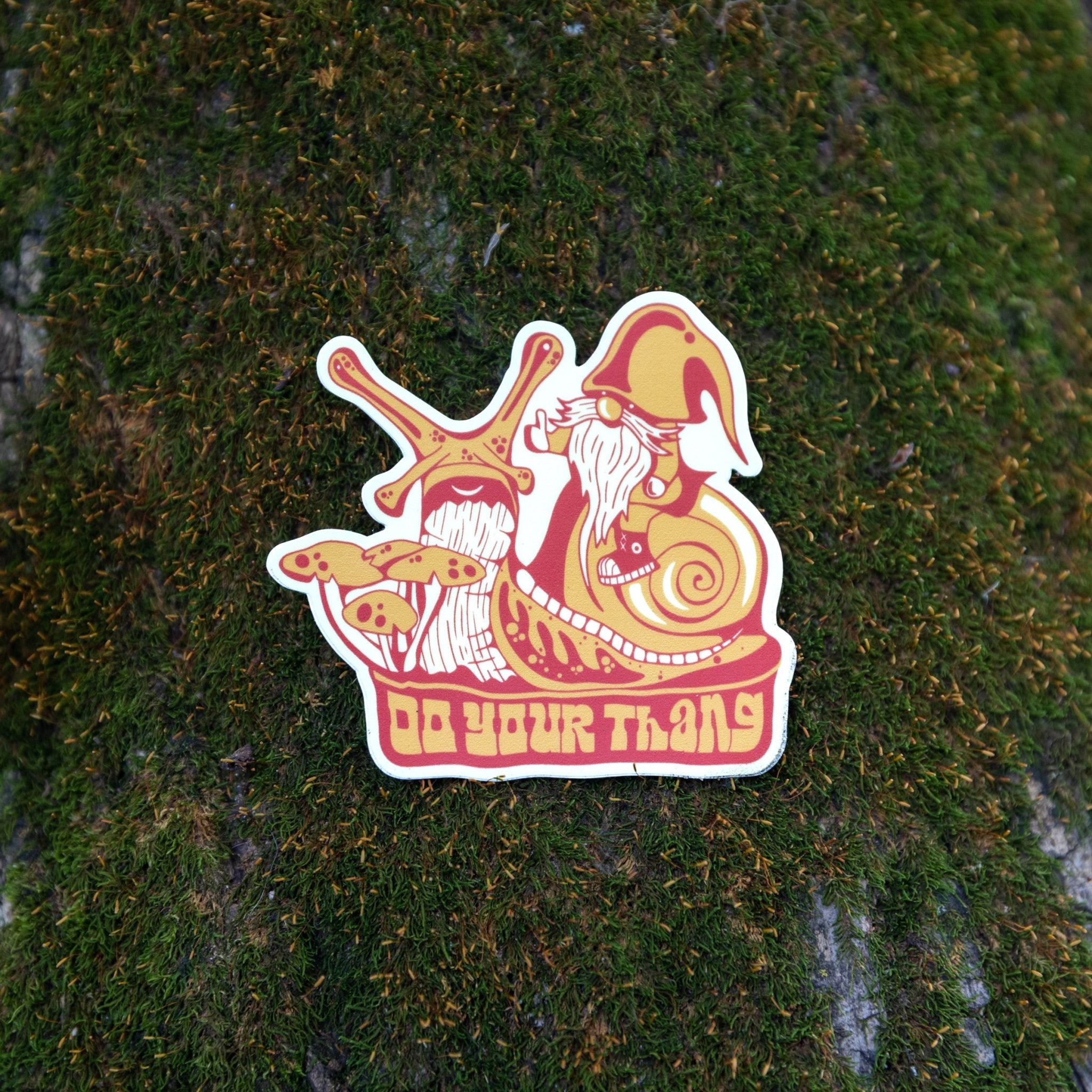Sticker lying flat on textured outdoor surface for scale
