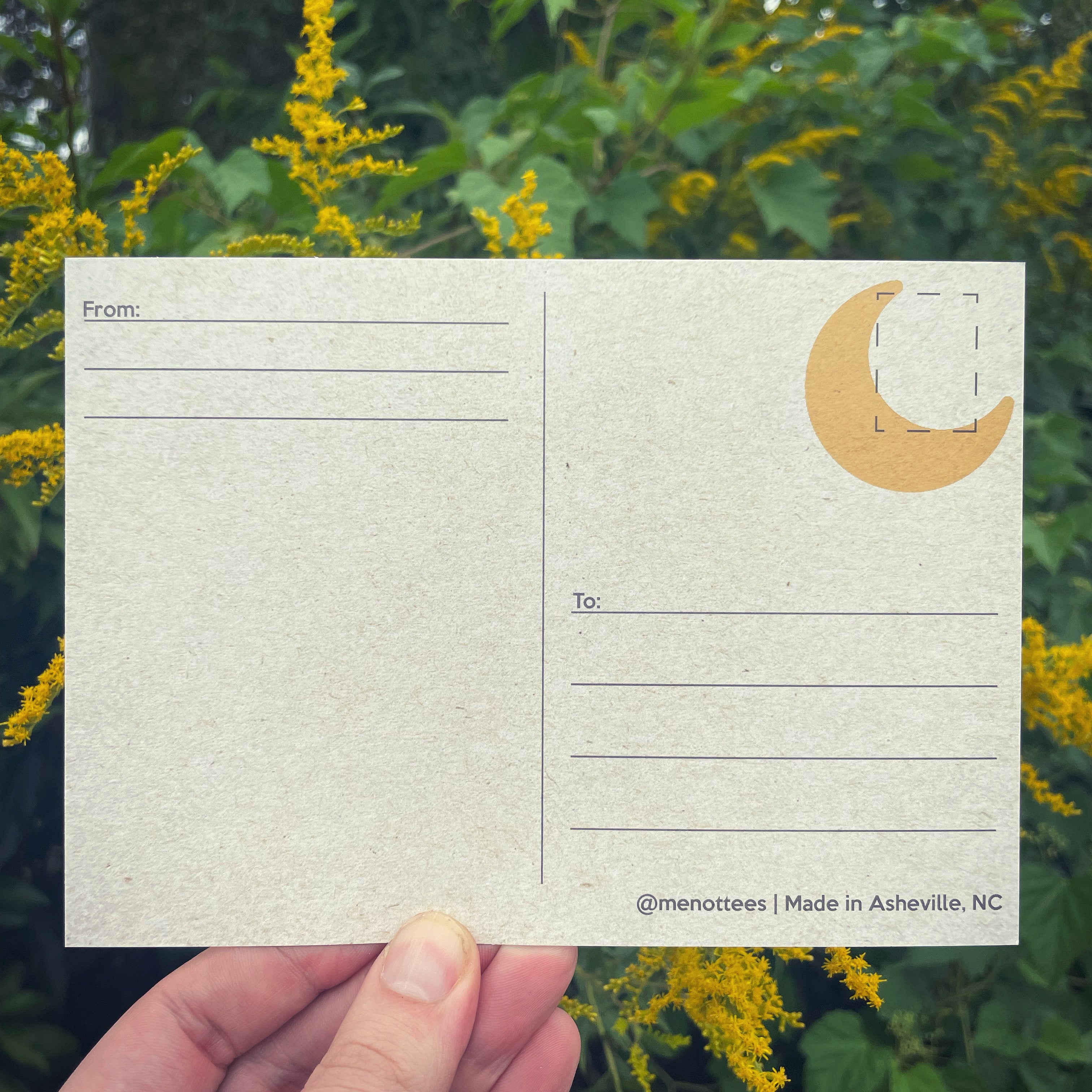 Back of postcard with subtle moon detail and space for writing