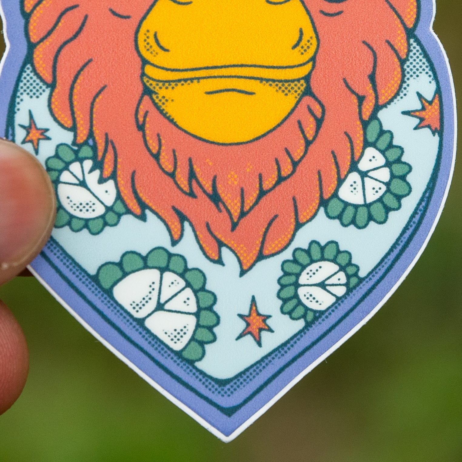 Zoomed-in view of the Bigfoot sticker’s face, highlighting the balloon sunglasses and detailed scarf design.


