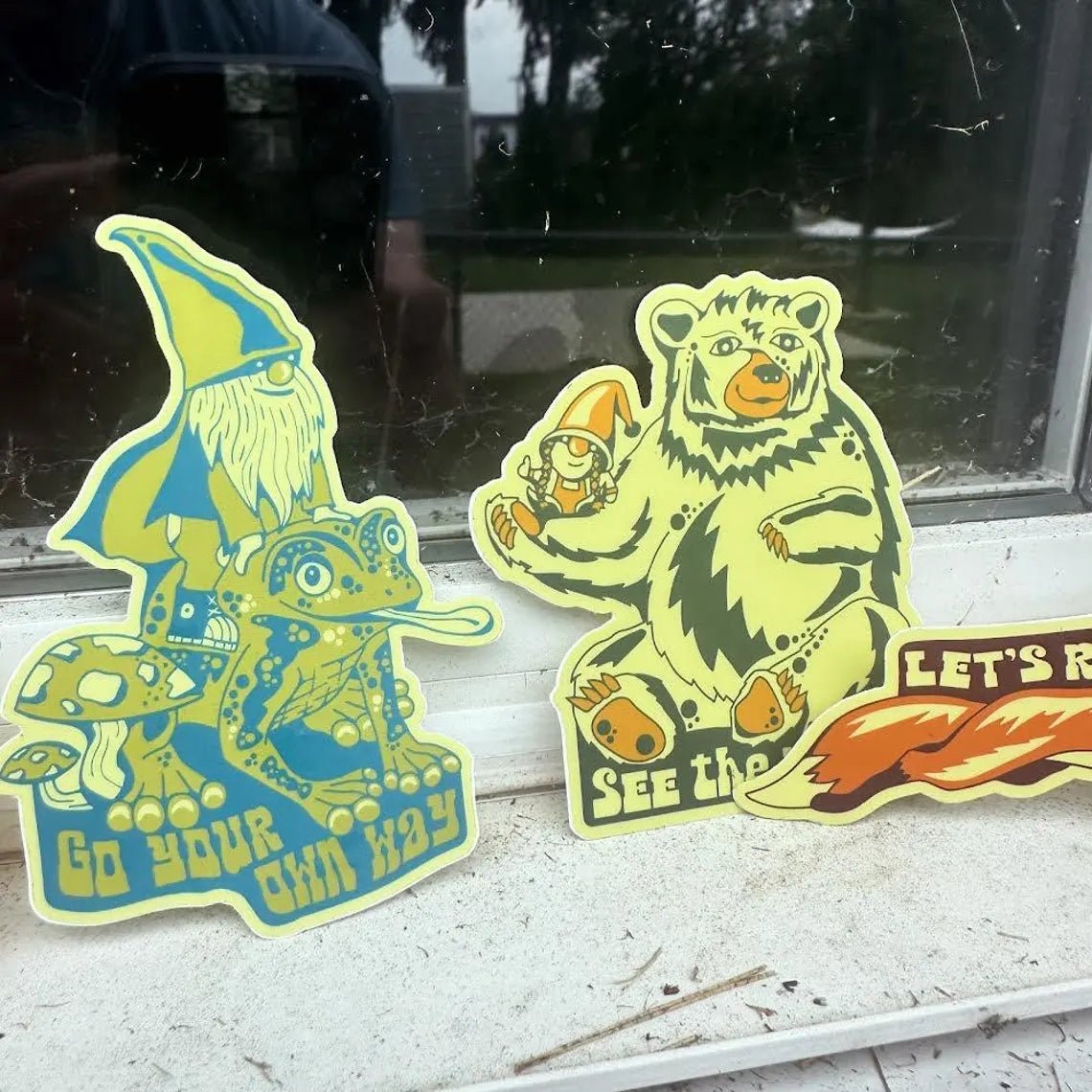 Stickers fanned out on a white surface, showcasing variety and details

