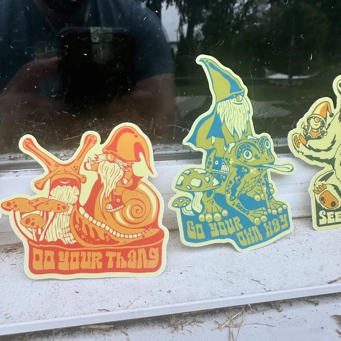 Stickers fanned out on a white surface, showcasing variety and details

