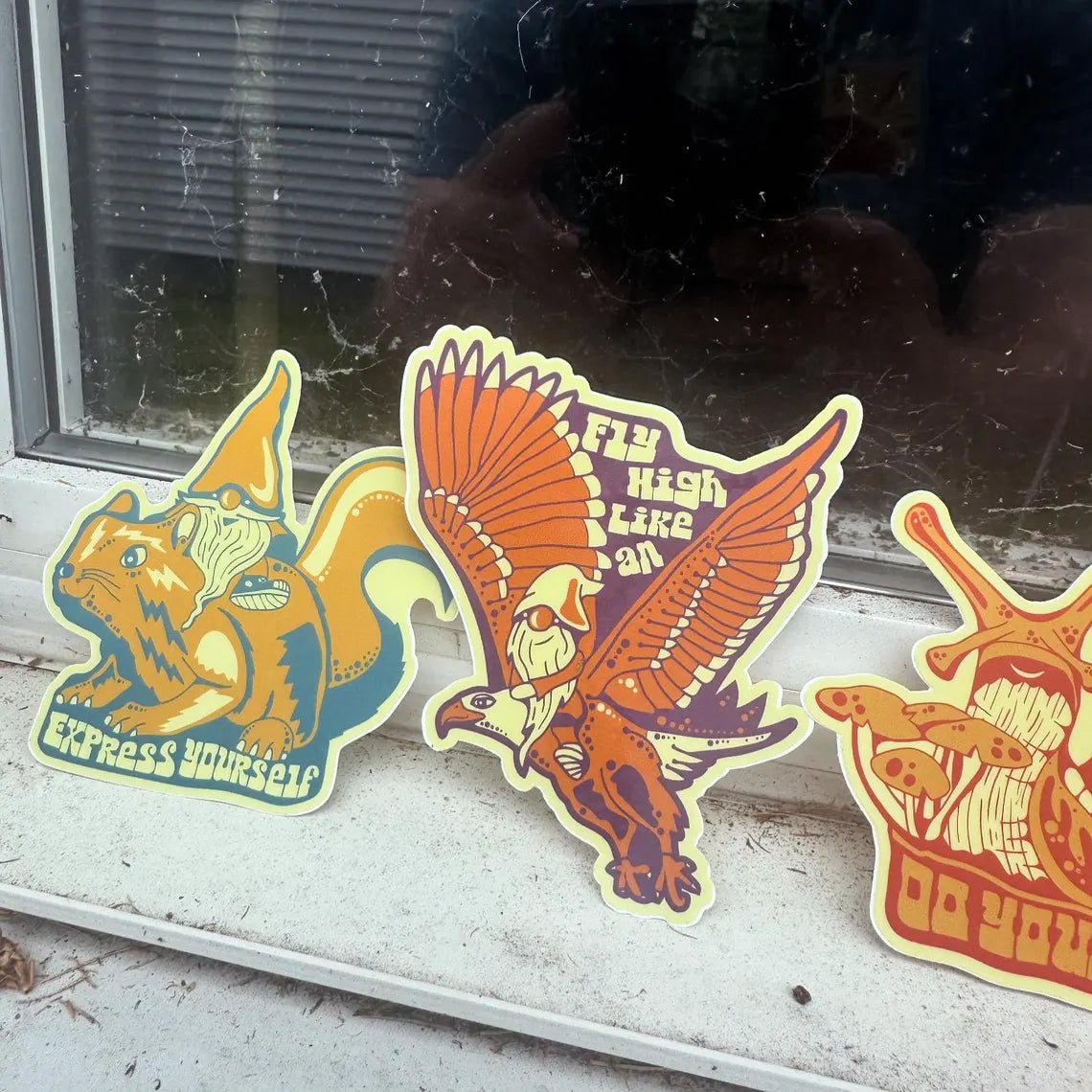 Stickers fanned out on a white surface, showcasing variety and details
