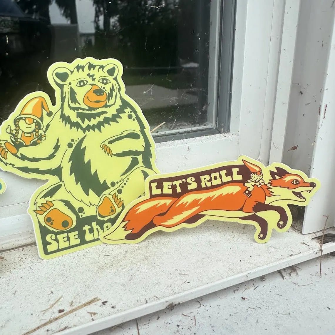 Stickers fanned out on a white surface, showcasing variety and details

