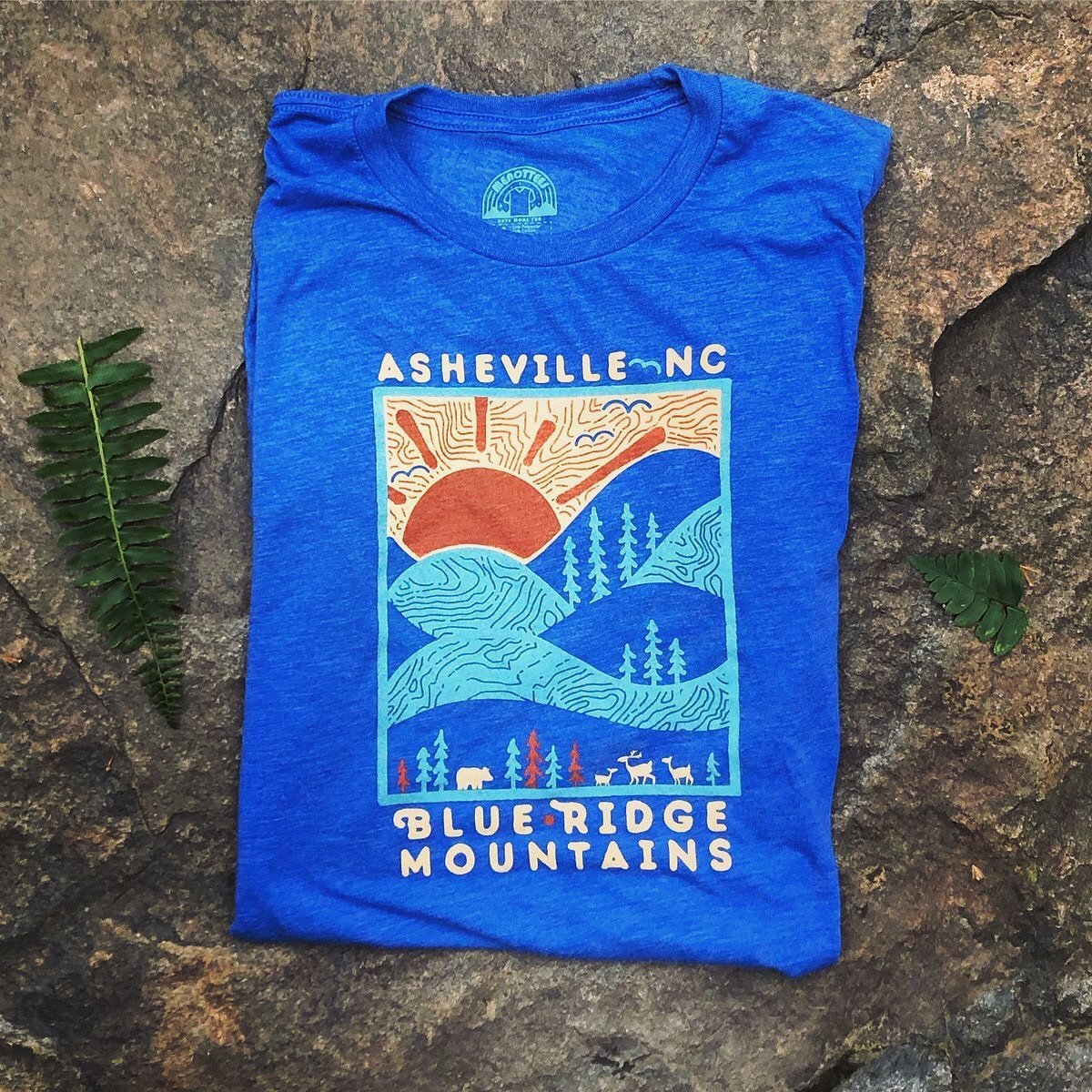 Backside view of the shirt with full graphic visible, showcasing soft fabric texture.

