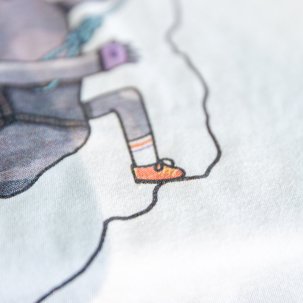 Close-up of Rock Climbing shirt artwork. Funny cartoon of a determined rock scaling a cliff.