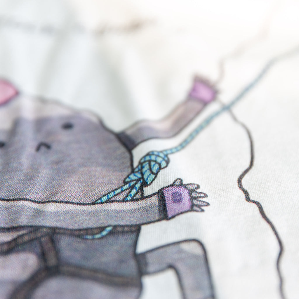 Close-up of Rock Climbing shirt artwork. Funny cartoon of a determined rock scaling a cliff.