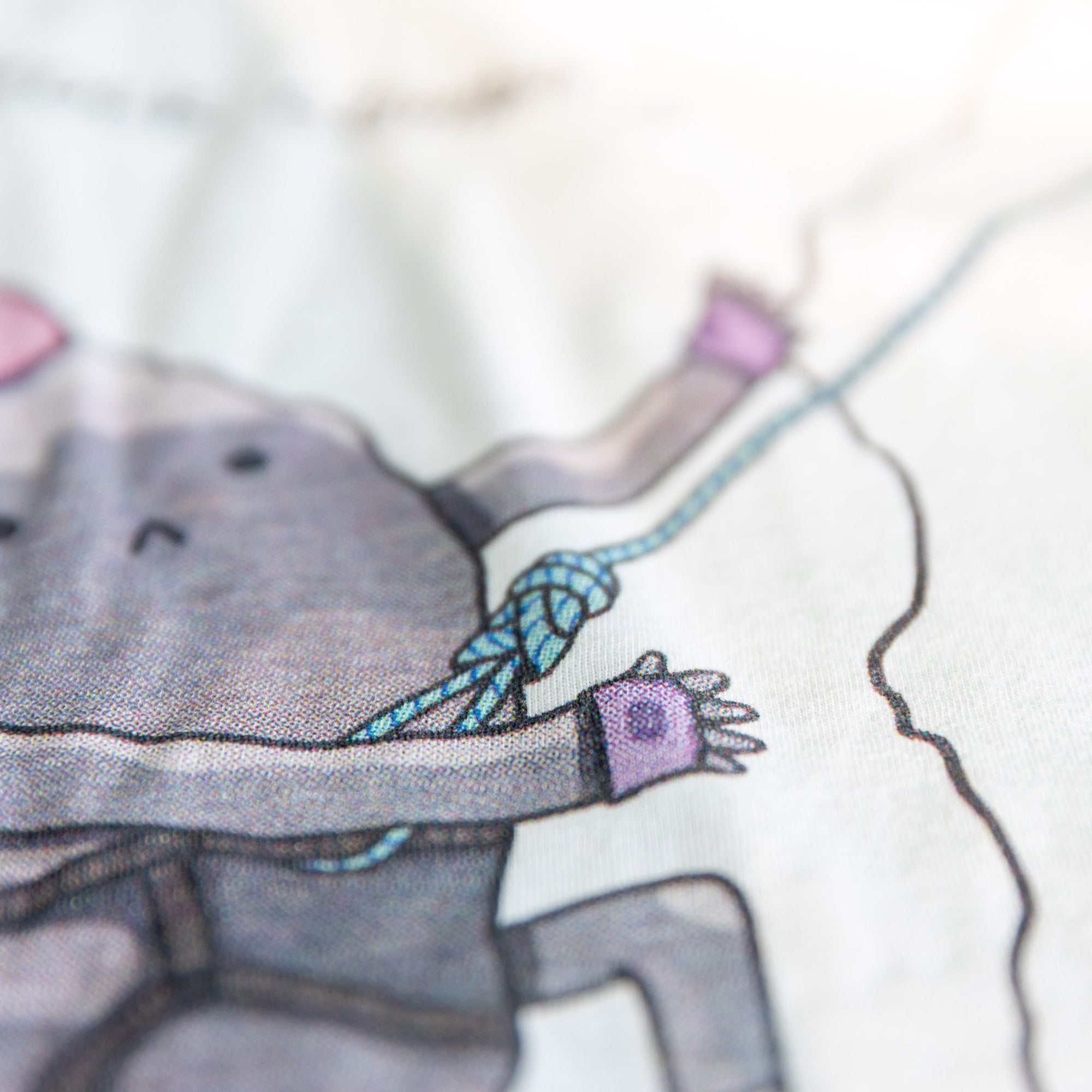 Close-up of Rock Climbing shirt artwork. Funny cartoon of a determined rock scaling a cliff.
