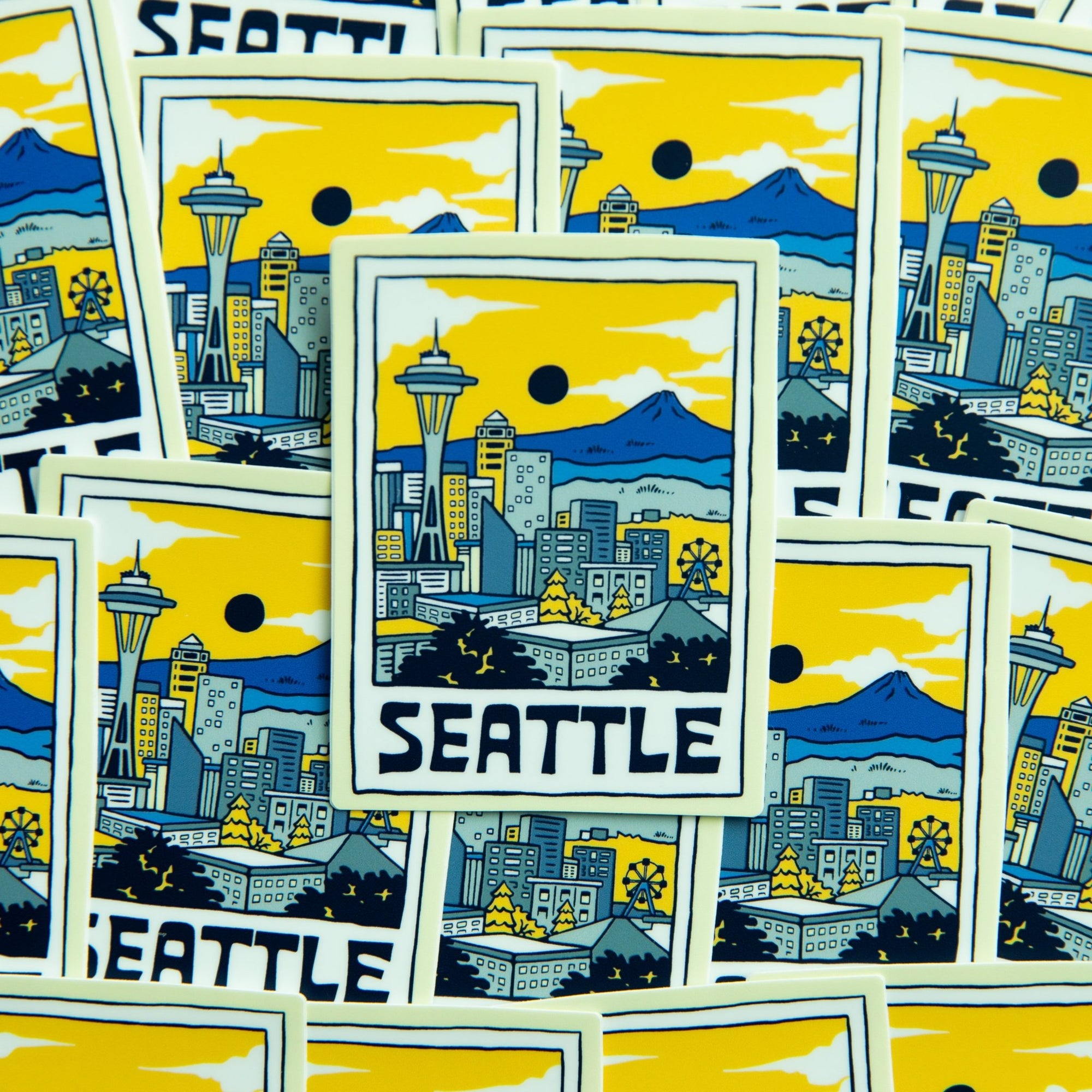 Group of Seattle stickers laid out side by side

