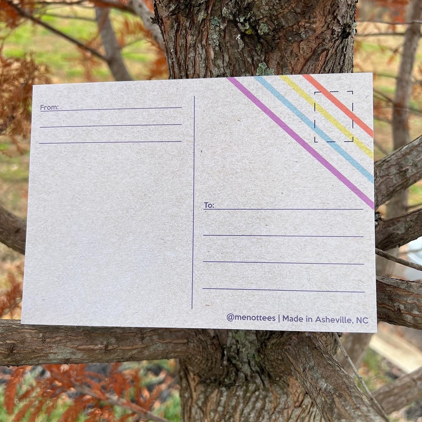 Back of postcard with space for writing and a faint illustration detail

