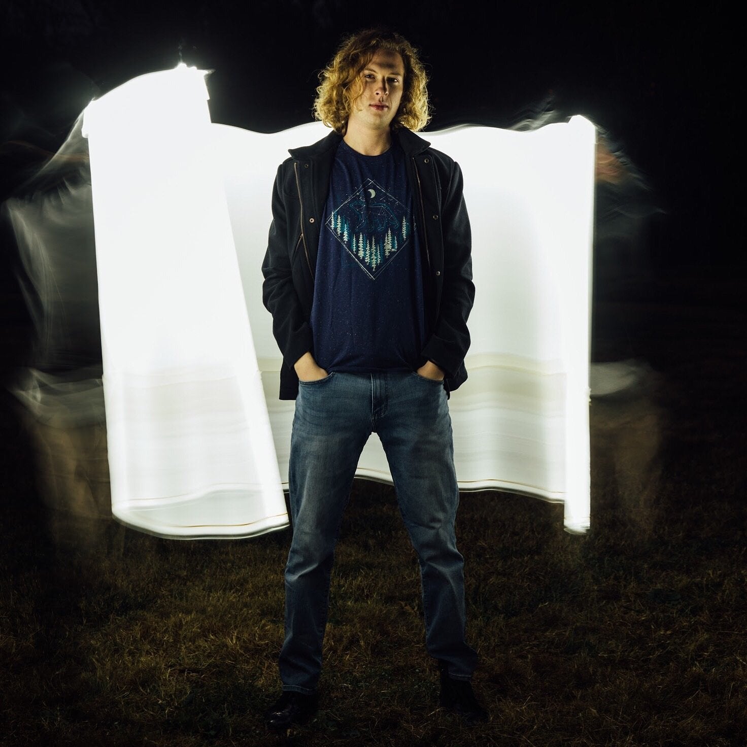 Model standing with arms relaxed, showing full shirt design

