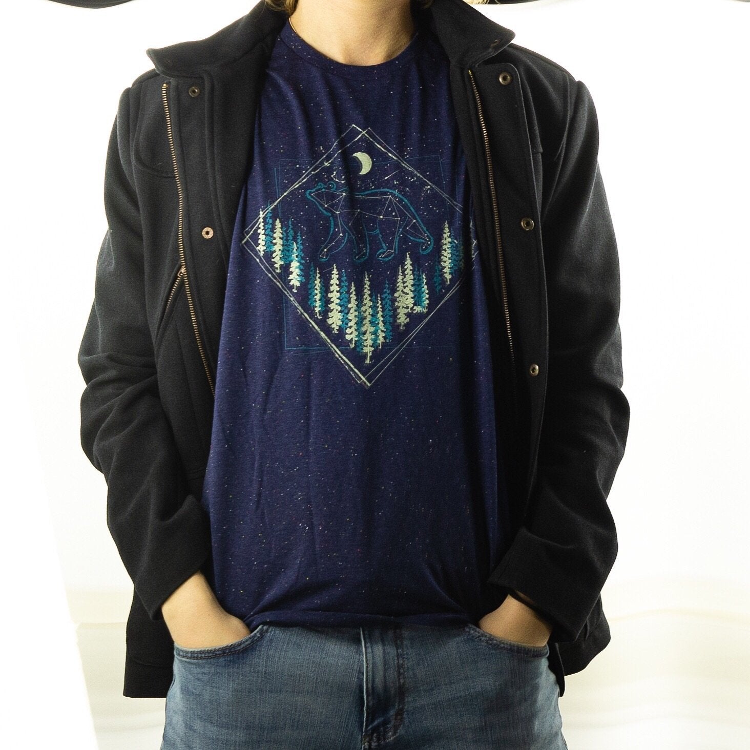 Person wearing the shirt under a jacket, front view outdoors

